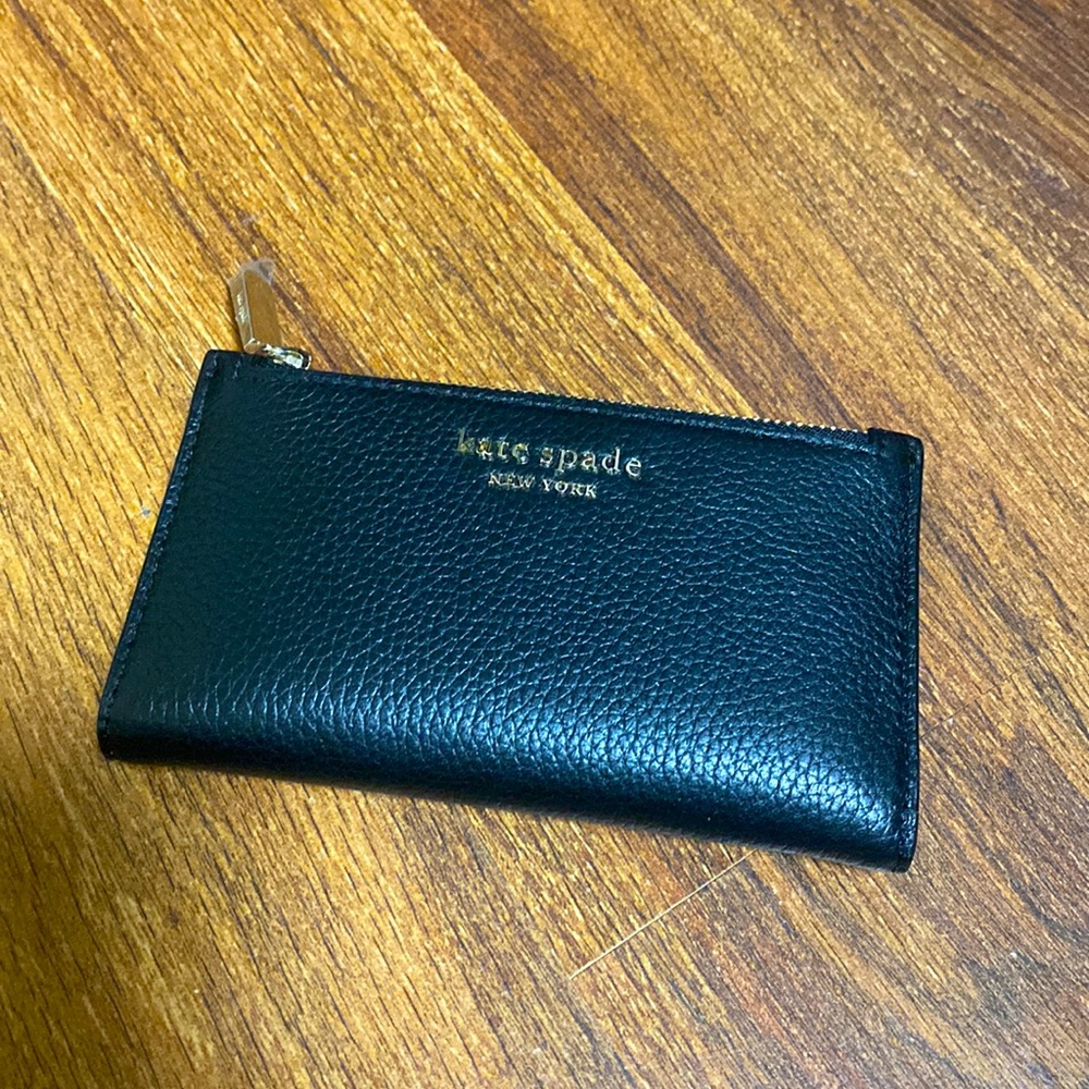 Kate spade wallet in black with pink interior